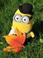 soft toy minion in green grass