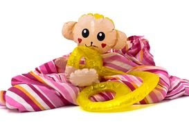 toy in the form of a monkey on a colorful scarf