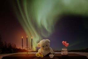 Teddy Bear reads book at night, collage