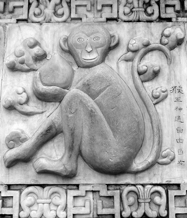 monkey sculpture on stonework