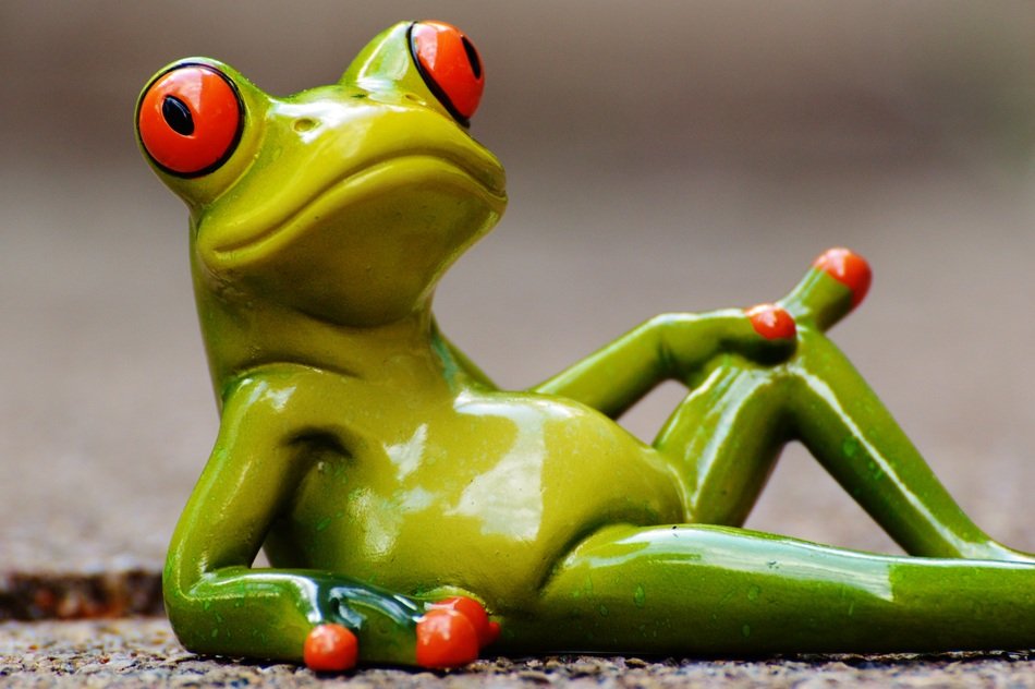 ceramic figure of a relaxed frog