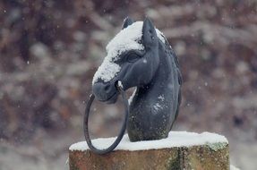 Snow on the statue of the horse