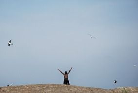 boy and birds in the sky