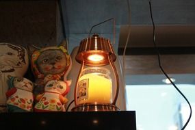 puppet cats toy near the lamp