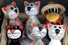 colorful funny Ceramic cat figurines in basket