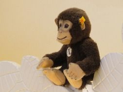 plush monkey on a white blanket