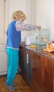 Child Feeding Fish in aquarium