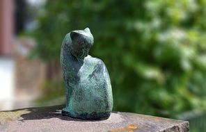 sculpture made of stone in the form of a cat