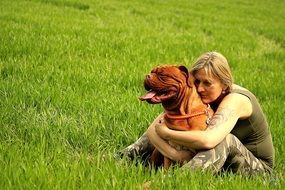 owner hugging his french mastiff