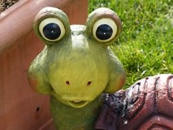 ceramic turtle on green grass in the garden