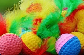 Foam balls of different colors with feathers