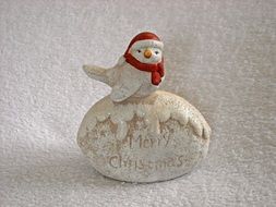 Christmas figurine with a little bird