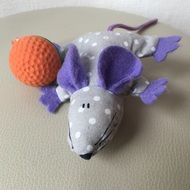 mouse made of cloth next to the ball