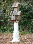 wooden birdhouses in the summer garden