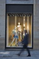 man goes near the shop window