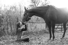 Black and white photo of the girl and horse