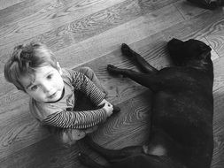 Dog with baby boy Black And White photo