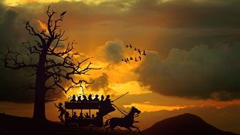 silhouettes of people in stagecoach at sunset