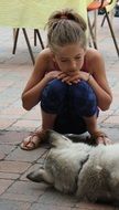 girl is watching for sleeping dog