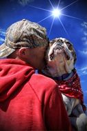 love of man and bulldog in the sun