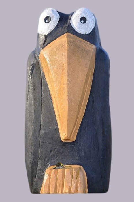wooden artifact in the form of a crow