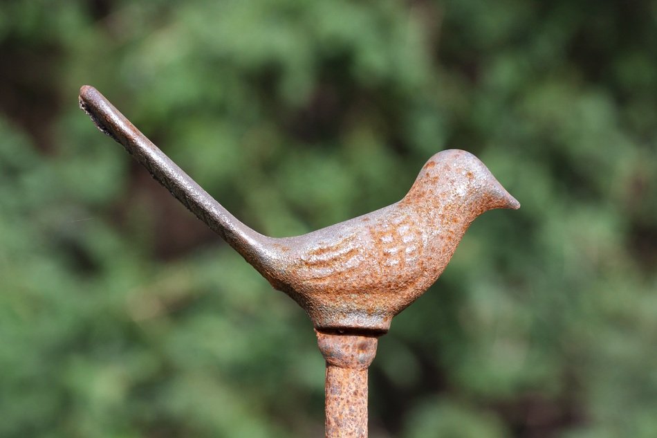 detail of bird figurine fence