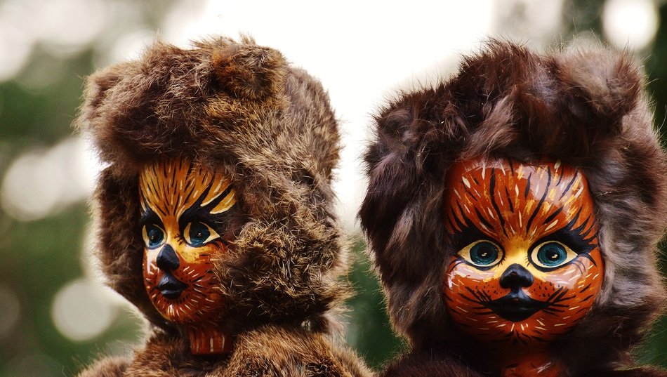 doll in brown suits and masks cat