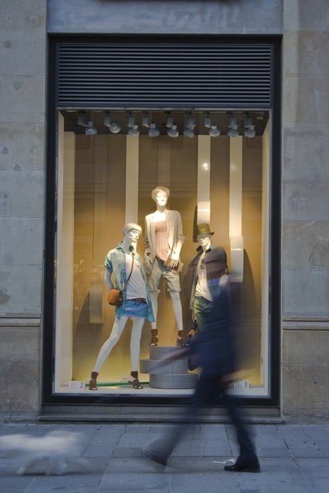 man goes near the shop window