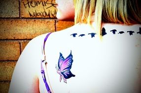 tattoo like a butterfly on the shoulder