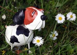 figure of a spotted dog in a flower meadow