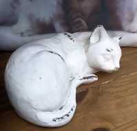 white clay cat as sculpture