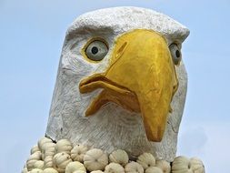 White ceramic eagle head with the yellow beak