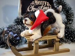 porcelain puppy on wooden sleigh