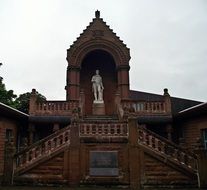 statue of robert burns on the building