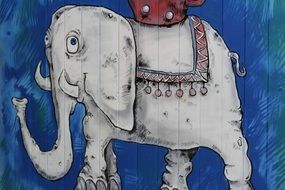 drawing of an elephant on a blue wall