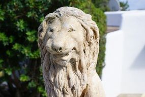 stone statue of a lion in the park