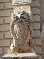 lion decorative statue on building facade in Malta