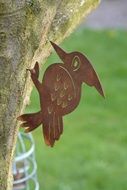 decoration in the form of a woodpecker on a tree