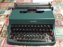 old green typewriter on the table