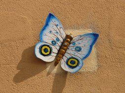 paper butterfly on yellow surface