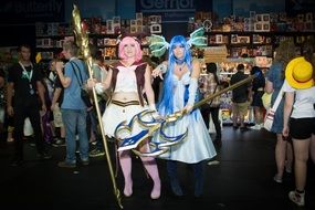 two ladies in cosplay costumes