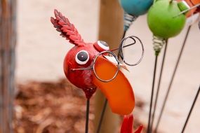 decorative figurine of a bird in glasses