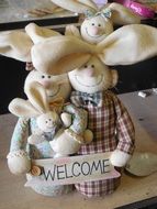 hare family with WELCOME board, decoration