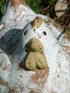 ceramic white chicken in the garden