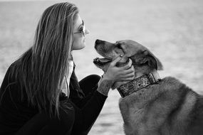 Black and white photo of girl and dog