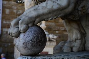 lion statue with sphere