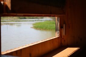 wooden log cabin on lake