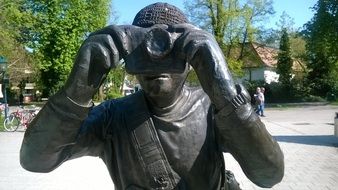 sculpture of a photographer on a sunny day