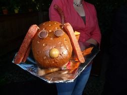 the dog's face is made of food on a tray