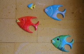 tile decorated by ceramic fishes